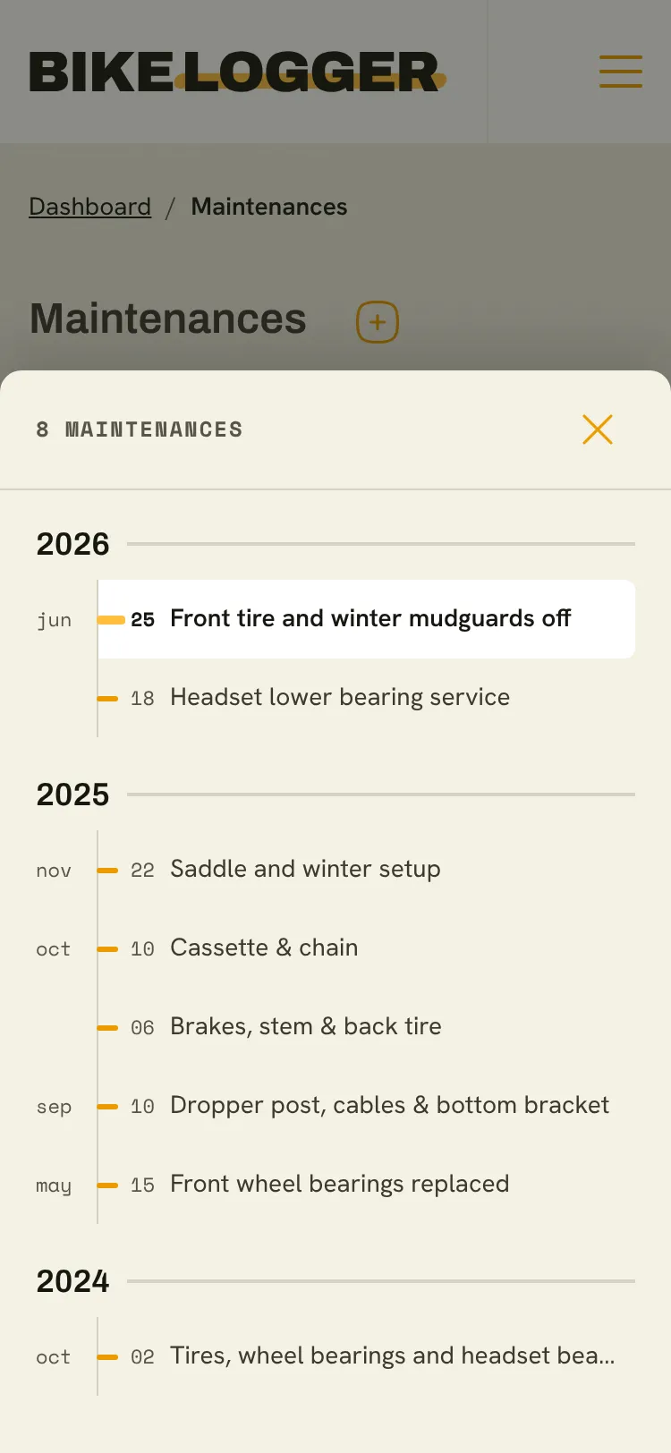 The maintenance timeline open on a phone, listing maintenances by year and month
